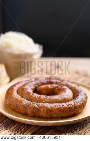 Northern Thai Sausage (sai Aua), Grilled Intestine Stuffed With Minced Pork, Spices And Herbs Eating