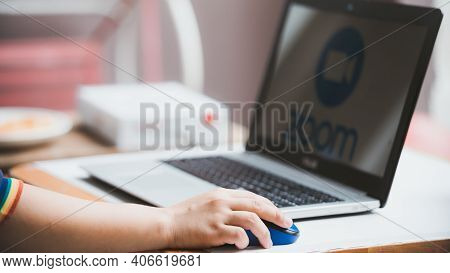 Bangkok, Thailand - April 11, 2020: Hand Posting Zoom Logo Meeting Video Conference Application And 