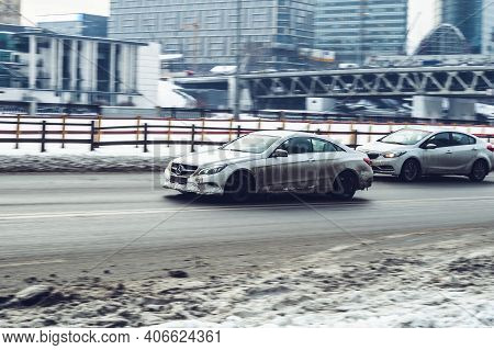 Moscow, Russia - January 15, 2021: Fast Moving Mercedes E-class W212, S212, C207 Rides On A Winter C