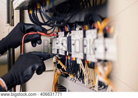 Electrician Engineer Work Tester Measuring Voltage And Current Of Power Electric Line In Electical C