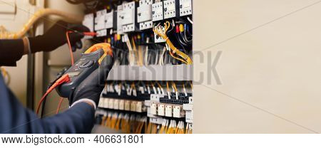 Electrician Engineer Work Tester Measuring Voltage And Current Of Power Electric Line In Electical C