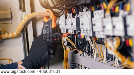Electrician Engineer Work Tester Measuring Voltage And Current Of Power Electric Line In Electical C