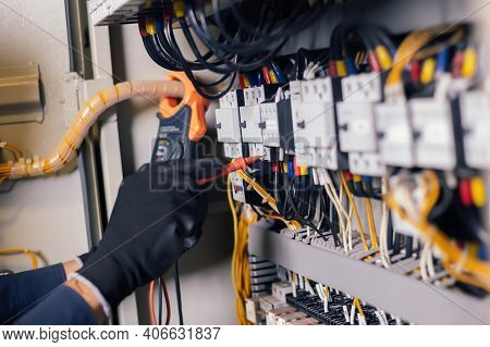 Electrician Engineer Work Tester Measuring Voltage And Current Of Power Electric Line In Electical C