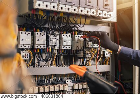 Electrician Engineer Work Tester Measuring Voltage And Current Of Power Electric Line In Electical C