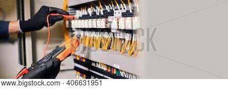 Electrician Engineer Work Tester Measuring Voltage And Current Of Power Electric Line In Electical C