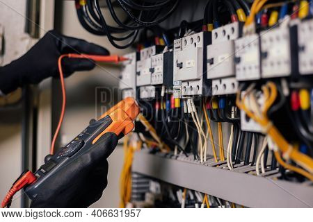 Electrician Engineer Work Tester Measuring Voltage And Current Of Power Electric Line In Electical C