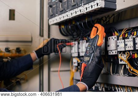 Electrician Engineer Work Tester Measuring Voltage And Current Of Power Electric Line In Electical C