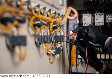 Electrician Engineer Work Tester Measuring Voltage And Current Of Power Electric Line In Electical C