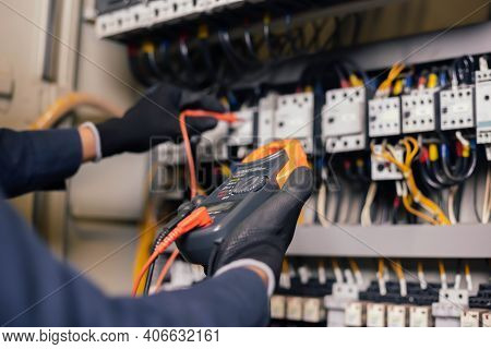 Electrician Engineer Work Tester Measuring Voltage And Current Of Power Electric Line In Electical C