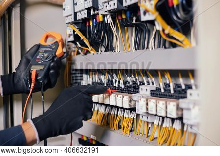 Electrician Engineer Work Tester Measuring Voltage And Current Of Power Electric Line In Electical C