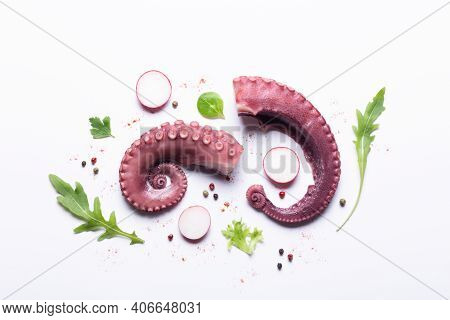 Tentacles Of Stew Octopus With Vegetables Isolated On White Background. Top View.