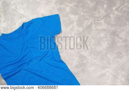 Blue Paint T-shirt With Copy Space. T-shirt Mockup, Flat Lay.