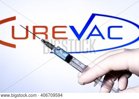 Madrid, Spain- February 3, 2020: Hand On White Surgery Glove Holding Syringe With Covid Vaccine. In 