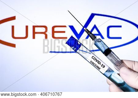 Madrid, Spain- February 3, 2020: Hand On White Surgery Glove Holding Syringe With Covid Vaccine. In 