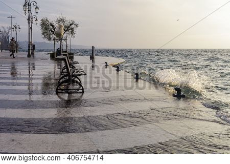 The Lakeside Of Lazise In Winter. The Heavy Rains Have Caused The Level Of Lake Garda To Rise Signif