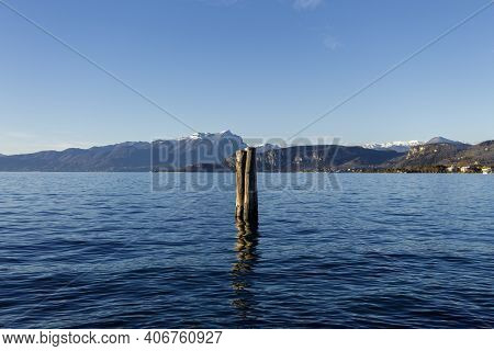 Wooden Poles Used For Docking Ferries At The Pier.