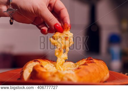 Woman Is Eating Adjarian Khachapuri With Hands, Crushing Egg Yolk.