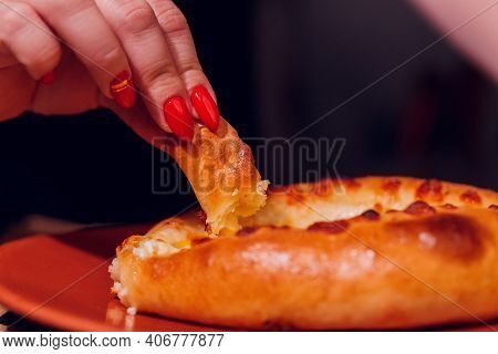 Woman Is Eating Adjarian Khachapuri With Hands, Crushing Egg Yolk.