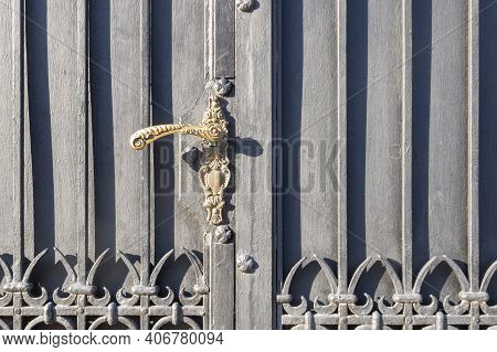 Old Metal Black Gate Decorated With Ornament And Fansy Color Handle.