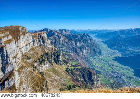 Summit From Churfirsten Zuestoll With A Beautiful View Of The Valley And The Small Village Of Wallen