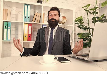 Manager With Headphones Listening Peaceful Melody. Meditation In Office. Relaxing And Calming Down. 