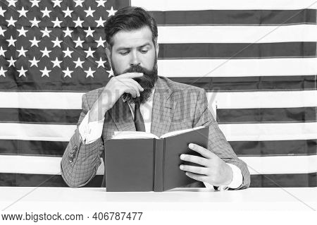 All Should Have Freedom To Pursue Education. Teacher Read Book On American Flag. Education In Usa. A