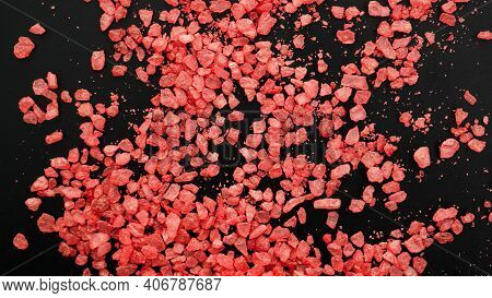 Salt Isolated On A Black Background. A Pile Of Red Salt. Large Crystalline Salt. Beauty And Health C