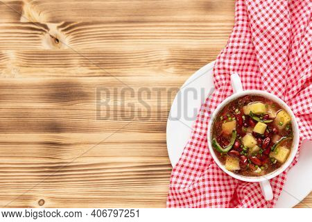 Delicious Bean Soup With Meat On A Wooden Background. Copy Space. Top View.
