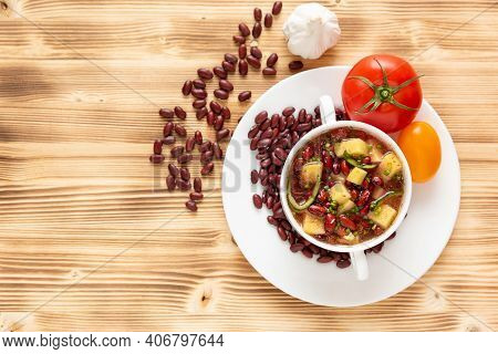 Red Bean Soup With Potatoes, Tomatoes And Paprika In A Ceramic Bowl. Top View.