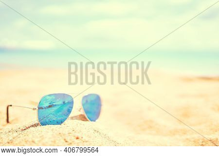 Sunglasses On The Beach. Summer Holidays At The Sea. Vacation On The Ocean. Reflection Of Sandy Beac