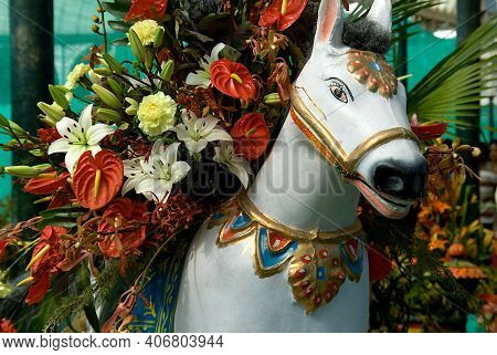 Close-up Of Plaster Image Of White Horse Laden With Flowers At Republic Day Flower Show At Lalbagh I