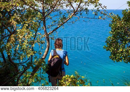 A Woman Hiker With A Backpacker Looking The Sea Of Strunjan, Slovenia