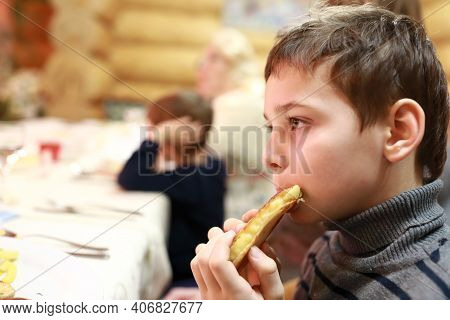 Child Eating Qistibi With Potato In Tatar Restaurant