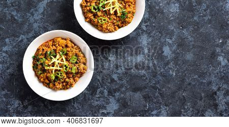 Keema Curry In Bowl Over Blue Stone Background With Copy Space. Indian And Pakistani Style Dish. Top