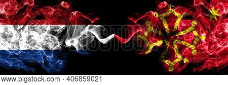 Netherlands Vs Occitania Smoky Mystic Flags Placed Side By Side. Thick Colored Silky Abstract Smoke 
