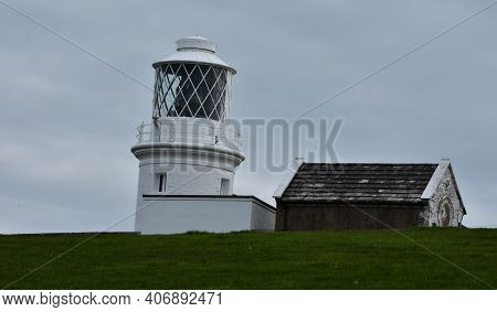 Light Tower Of St Bees Lighthosue Above The Hill.