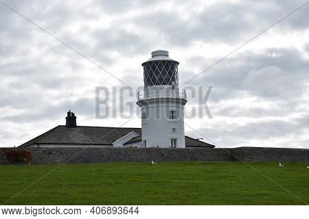 St Bees Lighthouse On A Cloudy Day In England.