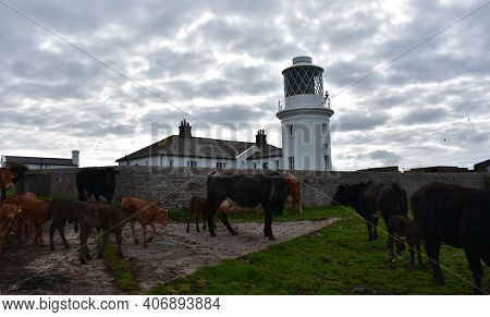 Thick Clouds Surrounding St Bees Lighthouse In England.