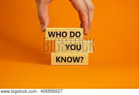 Who Do You Know Symbol. Businessman Hand. Wooden Blocks With Words 'who Do You Know'. Beautiful Oran