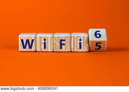 Wifi 5 Or 6 Symbol. Turned A Wooden Cube And Changed The Words Wifi 5 To Wifi 6. Beautiful Orange Ba