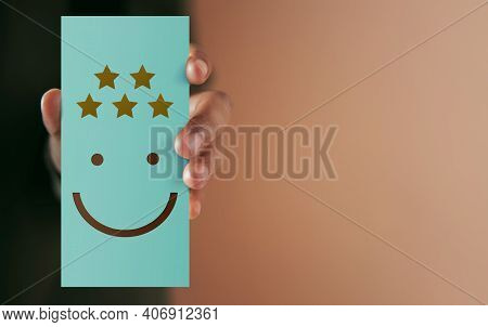 Customer Experience Concept. Happy Client Giving Positive Review On Paper Card. Feedback A Happy Fac