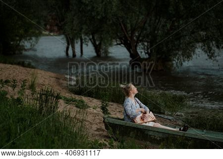 A Girl Sits In A Boat With A Harp During The Flood Of The Oka River Between Tarusa And Serpukhov
