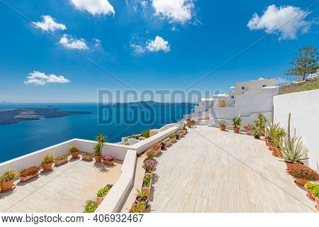 White Wash Staircases On Santorini Island, Greece. The View Toward Caldera Sea With Flowers. Terrace