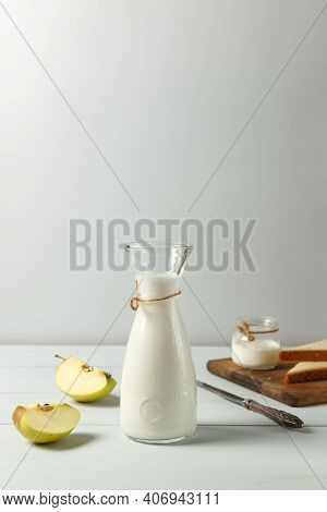 Glass Jug With Kefir Or Milk, Lactose-free Milk. Toast On A Wooden Board And An Apple. Vertically Wi