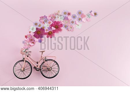 Flowers Fly Out From Pink Bicycle Bascet On Pink Background. Romanitic Concept For Valentine Day, Wo