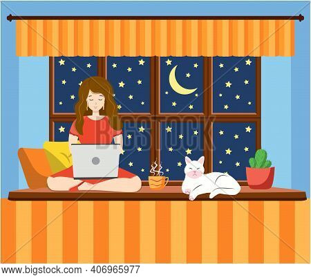 A Woman Works At A Laptop While Sitting On The Windowsill At Home. Freelance Concept, Quarantine Due