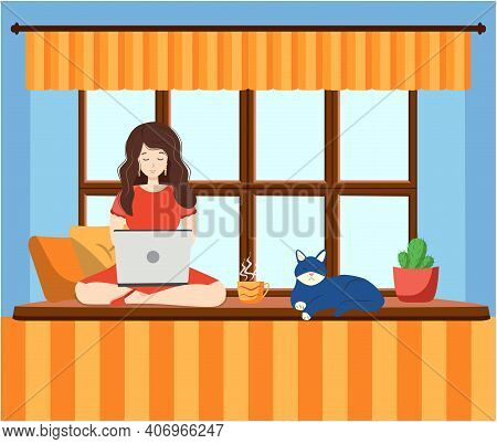 A Woman Works At A Laptop While Sitting On The Windowsill At Home. Freelance Concept, Quarantine Due