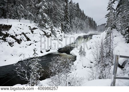 View Of Kivach Waterfall In The Winter Forest In Karelia, Russia