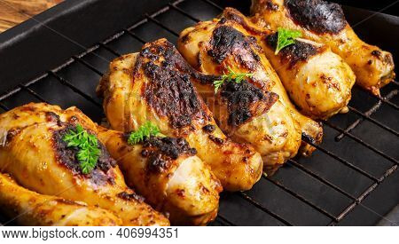 Fried Chicken Drumsticks Marinated In Red Marinade With Turmeric, Garlic, Mustard And Parsley. Chick