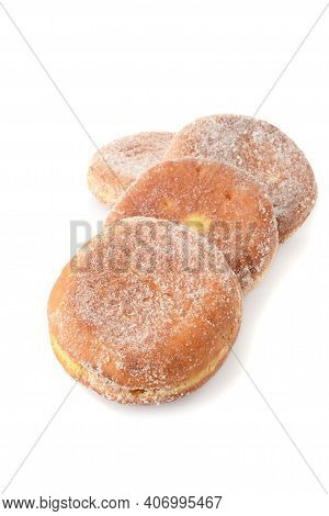 Row Of Paczki Donuts On A White Background